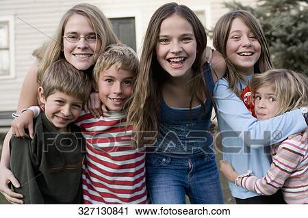 Portrait of a group of friends smiling together View Large Photo Image Stock Image - Portrait of a group of friends smiling together. Fotosearch