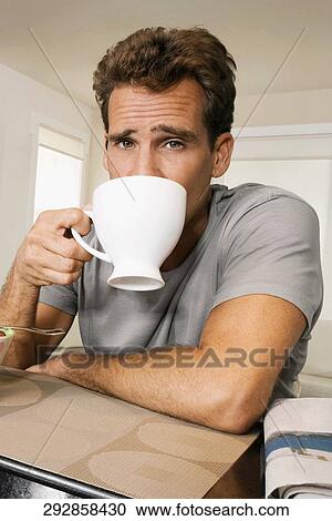 Portrait of a man drinking coffee View Large Photo Image Stock Image - Portrait of a man drinking coffee. Fotosearch