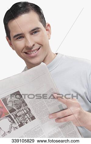 Portrait of a man reading a newspaper View Large Photo Image Stock Photo - Portrait of a man reading a newspaper. Fotosearch