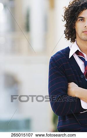 Portrait of a man standing with his arms crossed, Biltmore Hotel, Coral Gables, Florida, USA View Large Photo Image Stock Photo - Portrait of a man standing with his arms crossed, Biltmore Hotel, Coral Gables, Florida, USA. Fotosearch