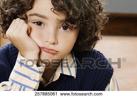 Portrait of a schoolboy in a classroom View Large Photo Image Stock Image - Portrait of a schoolboy in a classroom. Fotosearch