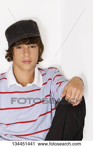 Portrait of a teenage boy sitting View Large Photo Image Stock Image - Portrait of a teenage boy sitting. Fotosearch