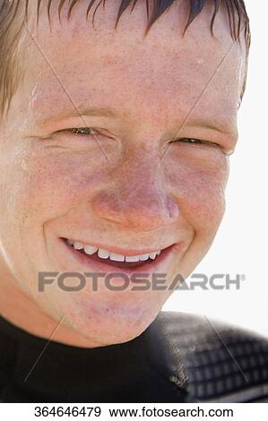 Portrait of a teenage boy smiling View Large Photo Image Stock Photo - Portrait of a teenage boy smiling. Fotosearch