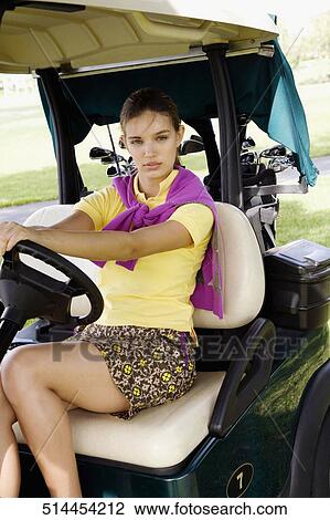 Portrait of a teenage girl sitting in a golf cart, Biltmore Golf Course, Coral Gables, Florida, USA View Large Photo Image Stock Image - Portrait of a teenage girl sitting in a golf cart, Biltmore Golf Course, Coral Gables, Florida, USA. Fotosearch