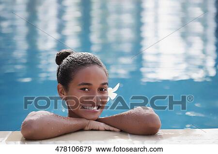 Portrait of a teenage girl smiling in a swimming pool View Large Photo Image Stock Photo - Portrait of a teenage girl smiling in a swimming pool. Fotosearch