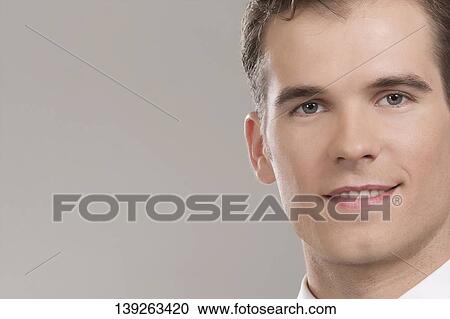 Stock Image - Portrait of a waiter smiling. Fotosearch