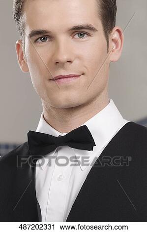 Portrait of a waiter smiling View Large Photo Image Stock Image - Portrait of a waiter smiling. Fotosearch
