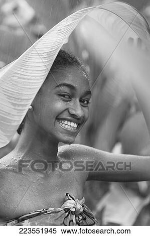 Portrait of a woman enjoying rain shower View Large Photo Image Stock Photography - Portrait of a woman enjoying rain shower. Fotosearch