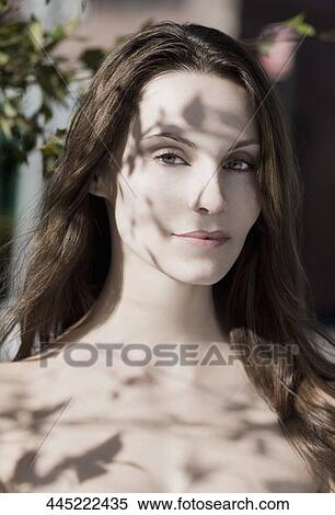 Stock Photography - Portrait of a woman grinning. Fotosearch