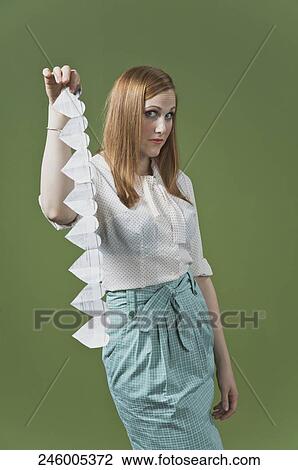 Portrait of a woman holding a heart shaped paper chain View Large Photo Image Stock Image - Portrait of a woman holding a heart shaped paper chain. Fotosearch