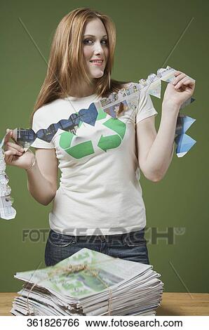 Stock Photograph - Portrait of a woman holding a heart shaped paper chain. Fotosearch