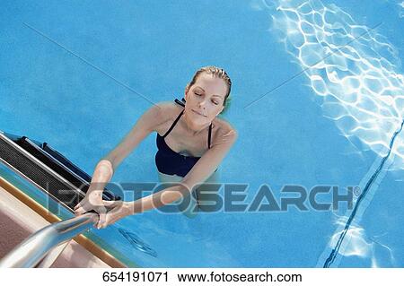 Portrait of a woman in a swimming pool, Biltmore Hotel, Coral Gables, Florida, USA View Large Photo Image Stock Image - Portrait of a woman in a swimming pool, Biltmore Hotel, Coral Gables, Florida, USA. Fotosearch