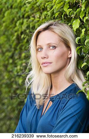 Portrait of a woman looking confident View Large Photo Image Stock Photo - Portrait of a woman looking confident. Fotosearch