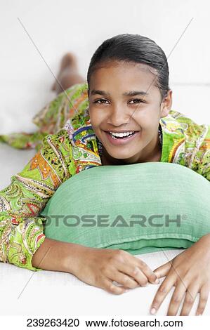 Portrait of a woman lying on the bed View Large Photo Image Stock Image - Portrait of a woman lying on the bed. Fotosearch