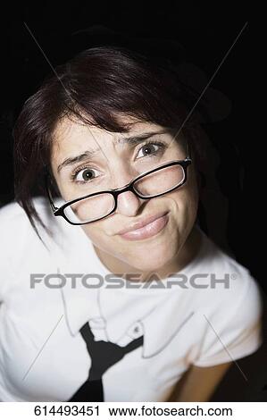 Stock Image - Portrait of a woman making a face. Fotosearch