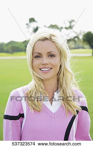 Portrait of a woman smiling, Biltmore Golf Course, Coral Gables, Florida, USA View Large Photo Image Picture - Portrait of a woman smiling, Biltmore Golf Course, Coral Gables, Florida, USA. Fotosearch