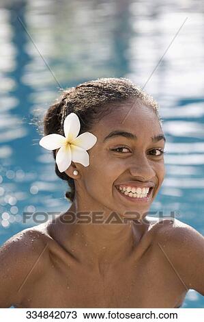 Portrait of a woman smiling in a swimming pool View Large Photo Image Stock Image - Portrait of a woman smiling in a swimming pool. Fotosearch