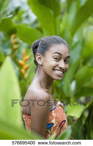 Portrait of a woman smiling in rain View Large Photo Image Stock Image - Portrait of a woman smiling in rain. Fotosearch