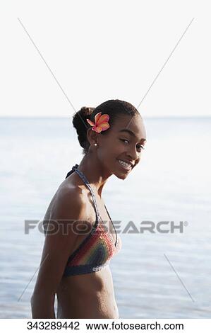 Portrait of a woman smiling on the beach View Large Photo Image Stock Image - Portrait of a woman smiling on the beach. Fotosearch