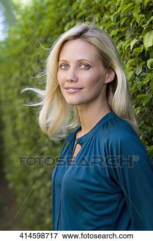 Portrait of a woman smiling View Large Photo Image Stock Photo - Portrait of a woman smiling. Fotosearch