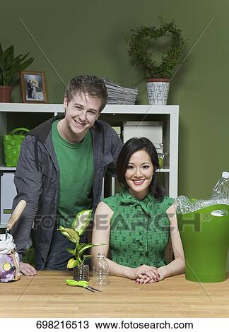 Stock Image - Portrait of a young couple smiling. Fotosearch