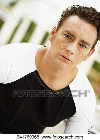 Portrait of a young man looking serious View Large Photo Image Stock Photo - Portrait of a young man looking serious. Fotosearch