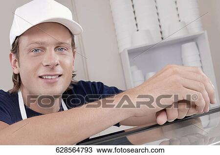 Stock Image - Portrait of an ice cream seller. Fotosearch