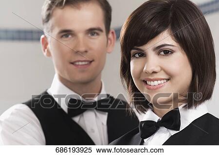 Portrait of two waiters in a restaurant View Large Photo Image Stock Photography - Portrait of two waiters in a restaurant. Fotosearch