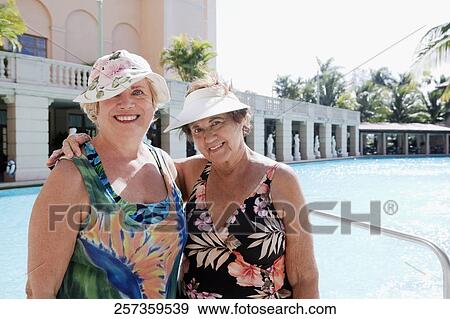Portrait of two women at the poolside, Biltmore Hotel, Coral Gables, Florida, USA View Large Photo Image Stock Photo - Portrait of two women at the poolside, Biltmore Hotel, Coral Gables, Florida, USA. Fotosearch