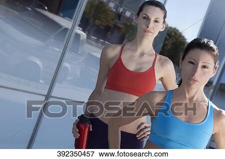 Stock Photo - Portrait of two women exercising. Fotosearch