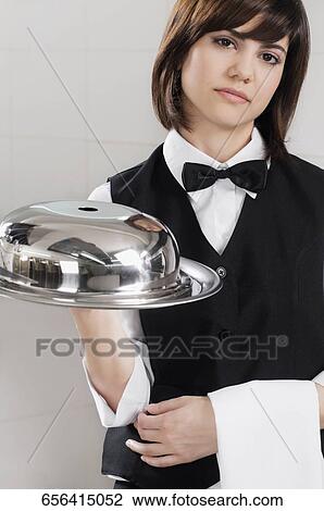 Portrait of waitress holding a domed tray View Large Photo Image Stock Image - Portrait of waitress holding a domed tray. Fotosearch