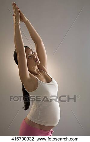 Pregnant woman practicing yoga View Large Photo Image Stock Image - Pregnant woman practicing yoga. Fotosearch