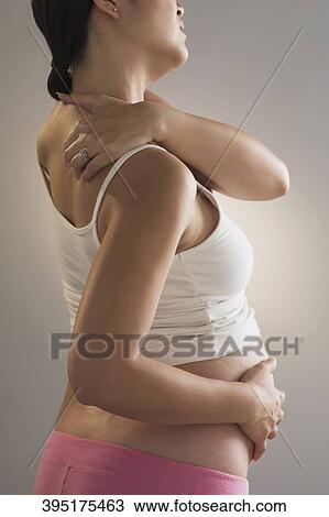 Pregnant woman suffering from backache View Large Photo Image Stock Image - Pregnant woman suffering from backache. Fotosearch