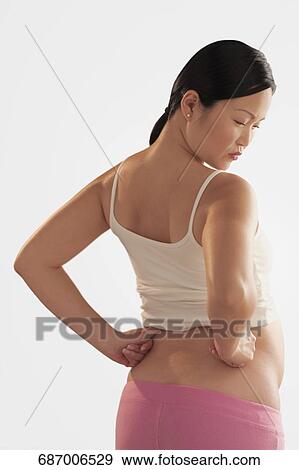 Pregnant woman suffering from backache View Large Photo Image Stock Photo - Pregnant woman suffering from backache. Fotosearch