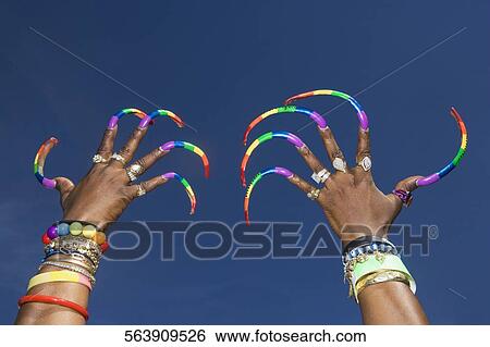 Stock Photograph - Raised hands of a gay man, Washington DC, USA. Fotosearch