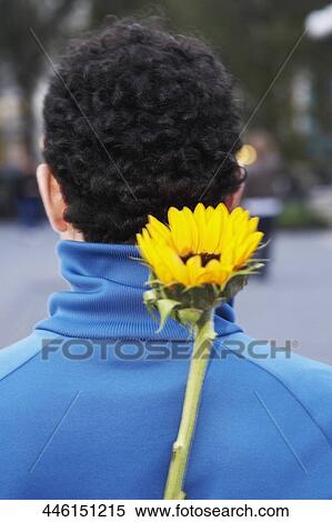 Rear view of a mid adult man with flower on his back View Large Photo Image Stock Photography - Rear view of a mid adult man with flower on his back. Fotosearch