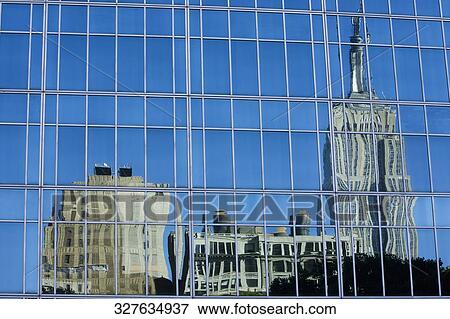 Reflection of buildings on window glasses, Empire State Building, Manhattan, Bryant Park, New York City, New York State, USA View Large Photo Image Stock Photo - Reflection of buildings on window glasses, Empire State Building, Manhattan, Bryant Park, New York City, New York State, USA. Fotosearch