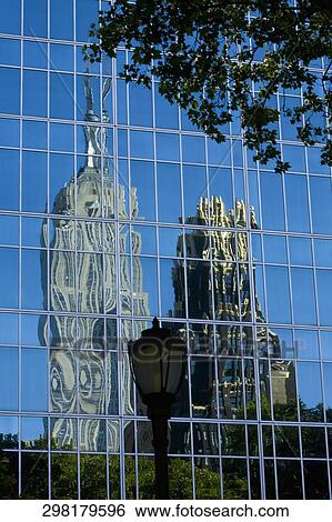 Reflection of buildings on window glasses, Empire State Building, Manhattan, Bryant Park, New York City, New York State, USA View Large Photo Image Stock Photograph - Reflection of buildings on window glasses, Empire State Building, Manhattan, Bryant Park, New York City, New York State, USA. Fotosearch