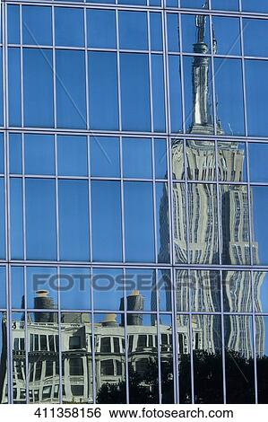 Reflection of buildings on window glasses, Empire State Building, Manhattan, Bryant Park, New York City, New York State, USA View Large Photo Image Stock Photograph - Reflection of buildings on window glasses, Empire State Building, Manhattan, Bryant Park, New York City, New York State, USA. Fotosearch