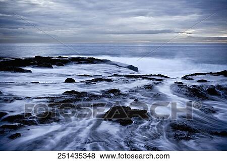 River flowing through rocks View Large Photo Image Stock Photo - River flowing through rocks. Fotosearch