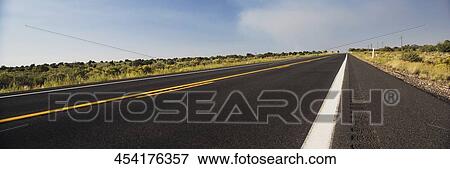 Road passing through a landscape, Arizona, USA View Large Photo Image Stock Photo - Road passing through a landscape, Arizona, USA. Fotosearch