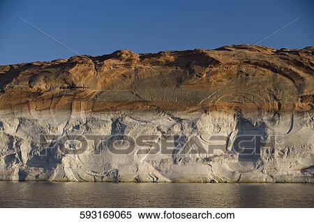 Rock formations at the riverside, Glen Canyon Dam, Lake Powell, Colorado River, Page, Arizona, USA View Large Photo Image Stock Photography - Rock formations at the riverside, Glen Canyon Dam, Lake Powell, Colorado River, Page, Arizona, USA. Fotosearch