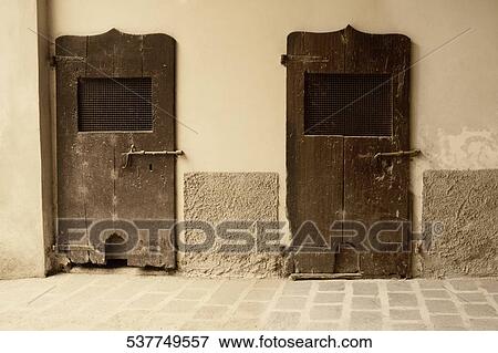 Rusty doors of a house, Mozzanica, Bergamo Province, Lombardy, Italy View Large Photo Image Stock Photo - Rusty doors of a house, Mozzanica, Bergamo Province, Lombardy, Italy. Fotosearch