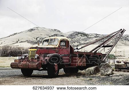Stock Photo - Rusty tow truck in a field, Montana, USA. Fotosearch