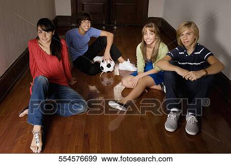 Stock Photo - School children sitting in the school corridor. Fotosearch