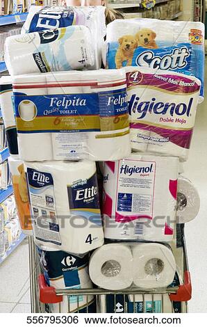 Stock Photograph - Shopping cart full of toiletries in a supermarket. Fotosearch