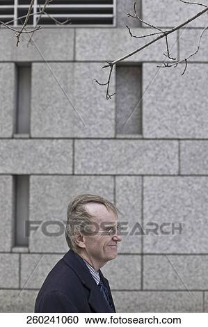 Side profile of a businessman smiling View Large Photo Image Stock Image - Side profile of a businessman smiling. Fotosearch