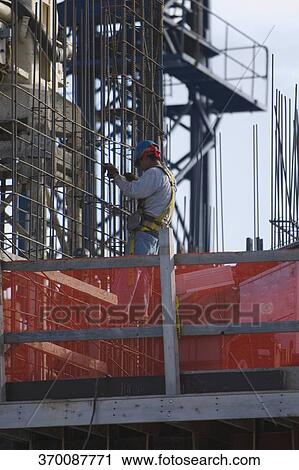 Side profile of a construction worker at a construction site View Large Photo Image Stock Image - Side profile of a construction worker at a construction site. Fotosearch