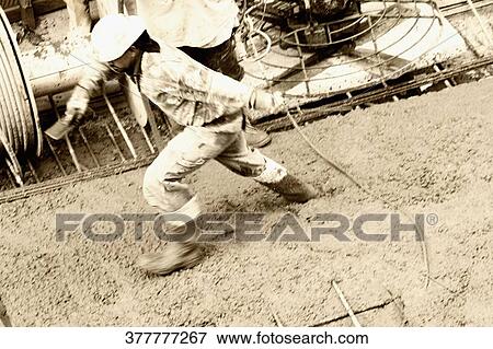 Side profile of a construction worker walking on concrete View Large Photo Image Stock Photo - Side profile of a construction worker walking on concrete. Fotosearch