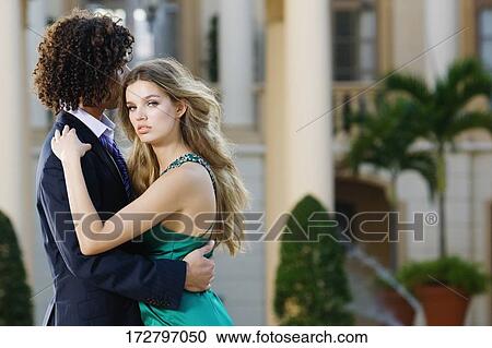 Stock Image - Side profile of a couple romancing, Biltmore Hotel, Coral Gables, Florida, USA. Fotosearch